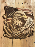 Wooden carving of an eagle with an American flag on a wooden background
