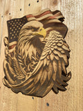 Wooden wall art of an eagle with an American flag on a wooden background
